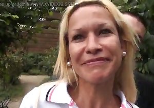 Blond-haired beauty with a smile worships cock